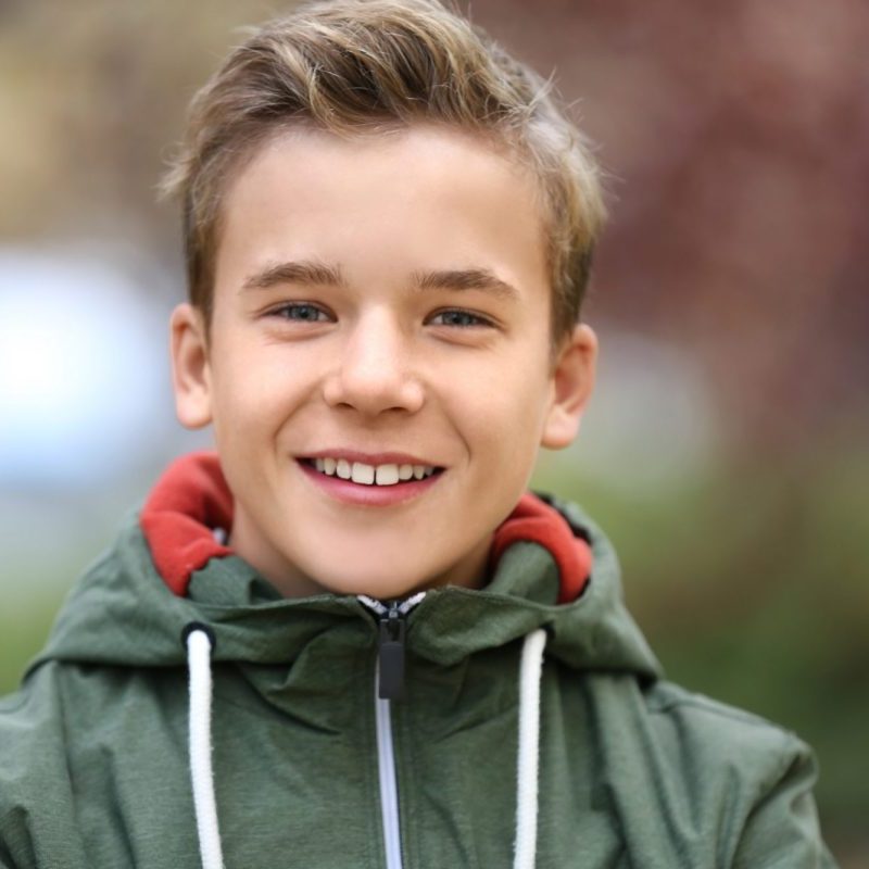 photo of a boy in an outdoor jacket